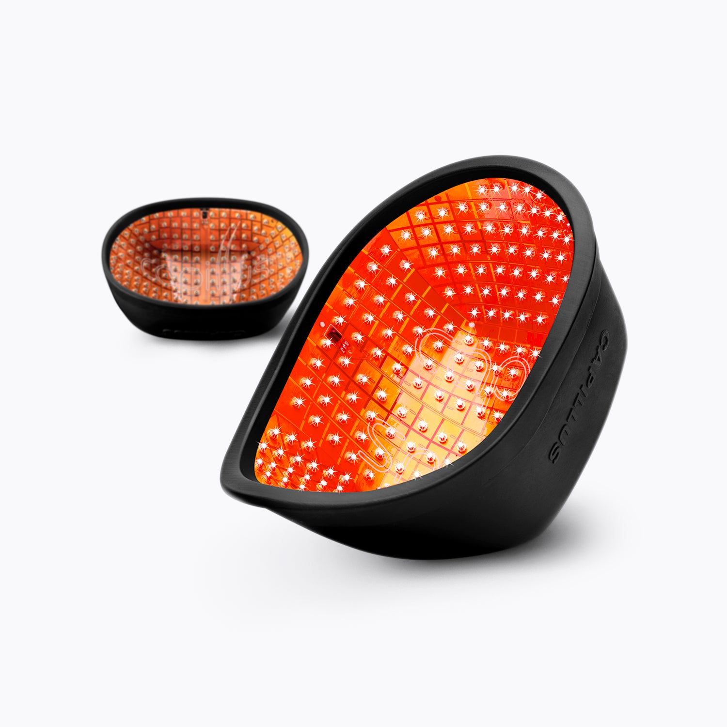 Two black, oval-shaped devices with bright red, illuminated interiors featuring multiple small LED lights arranged in a grid pattern, placed on a plain white background.