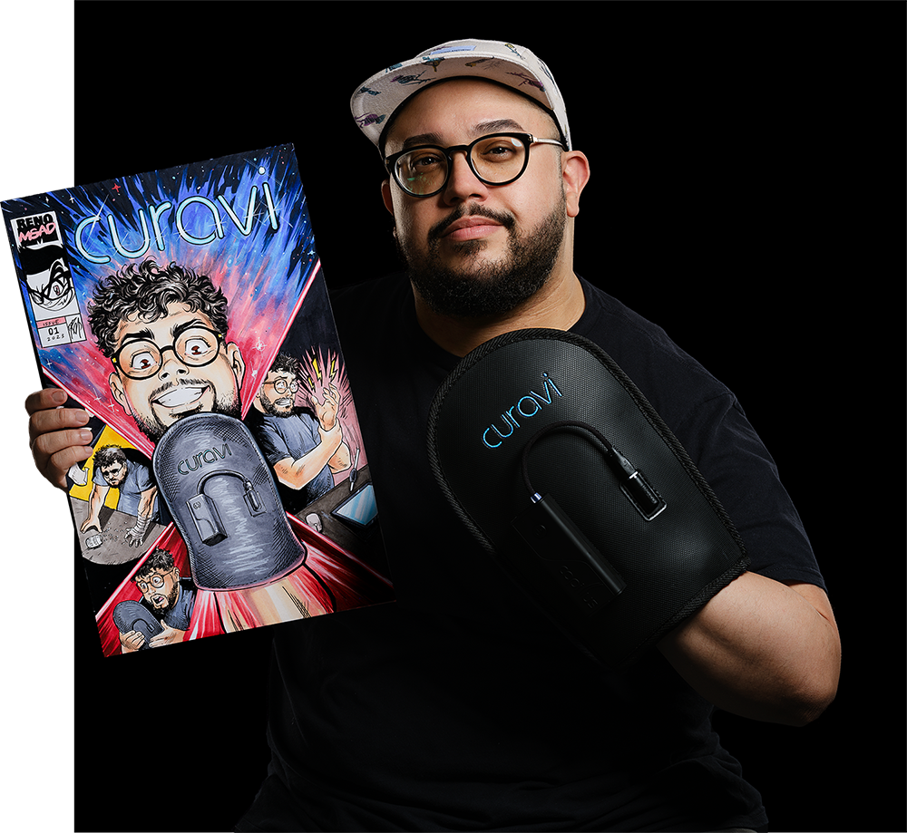 A man wearing glasses and a cap holds a comic-style poster featuring his likeness and the word curavi. He also displays a black curavi device strapped to his arm against a black background.