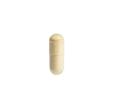A single beige capsule pill is centered on a plain white background.