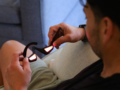 Dad using a red-light face device