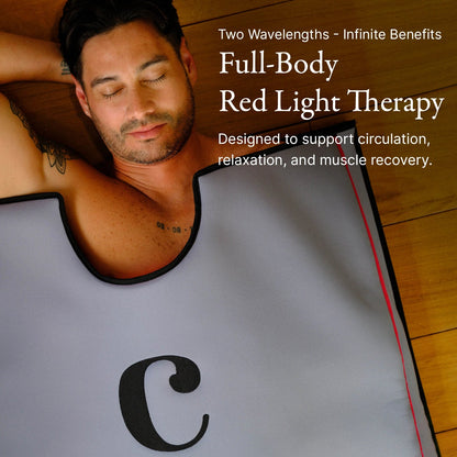 A man with dark hair relaxes inside a gray and black Healing Pod × WHOOP MG Life by Capillus. Text: Full-Body Red Light Therapy for recovery, circulation, relaxation, and muscle support.