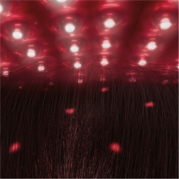 Gros plan sur des lumières LED rouges éclairant des cheveux foncés, suggérant un soin capillaire ou du cuir chevelu par luminothérapie rouge.
